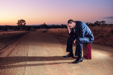 Frustrated businessman in the outback 